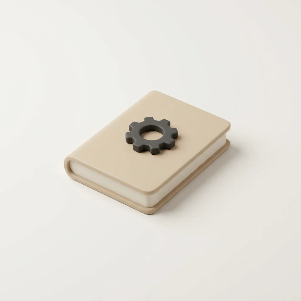 A closed book with a small gear charm resting on top
